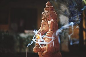 A Ganesh statue with incense at The Wondering Light Retreat in Goa, India